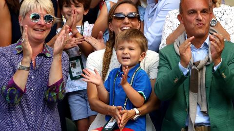 Novak Djokovic's son Stefan, 3, watches his father hoist the Wimbledon trophy in July 2018. 