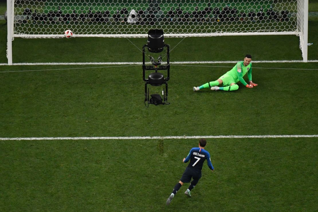 Griezmann (bottom) converts a penalty past Croatia's goalkeeper Danijel Subasic 