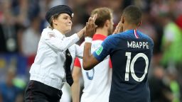 MOSCOW, RUSSIA - JULY 15:  A pitch invader high fives Kylian Mbappe of France during the 2018 FIFA World Cup Final between France and Croatia at Luzhniki Stadium on July 15, 2018 in Moscow, Russia.  (Photo by Clive Rose/Getty Images)