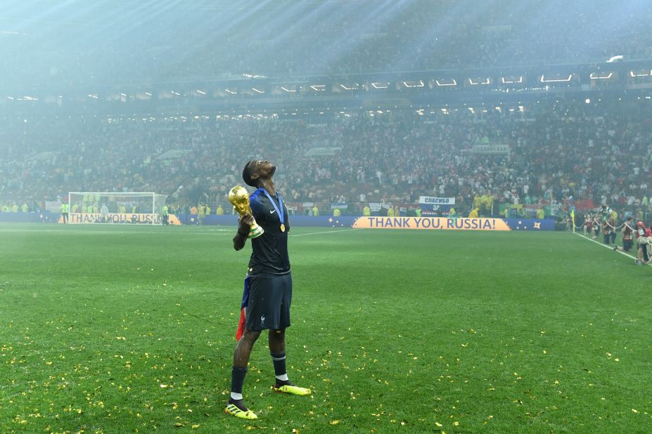 French midfielder Paul Pogba celebrates with the trophy.