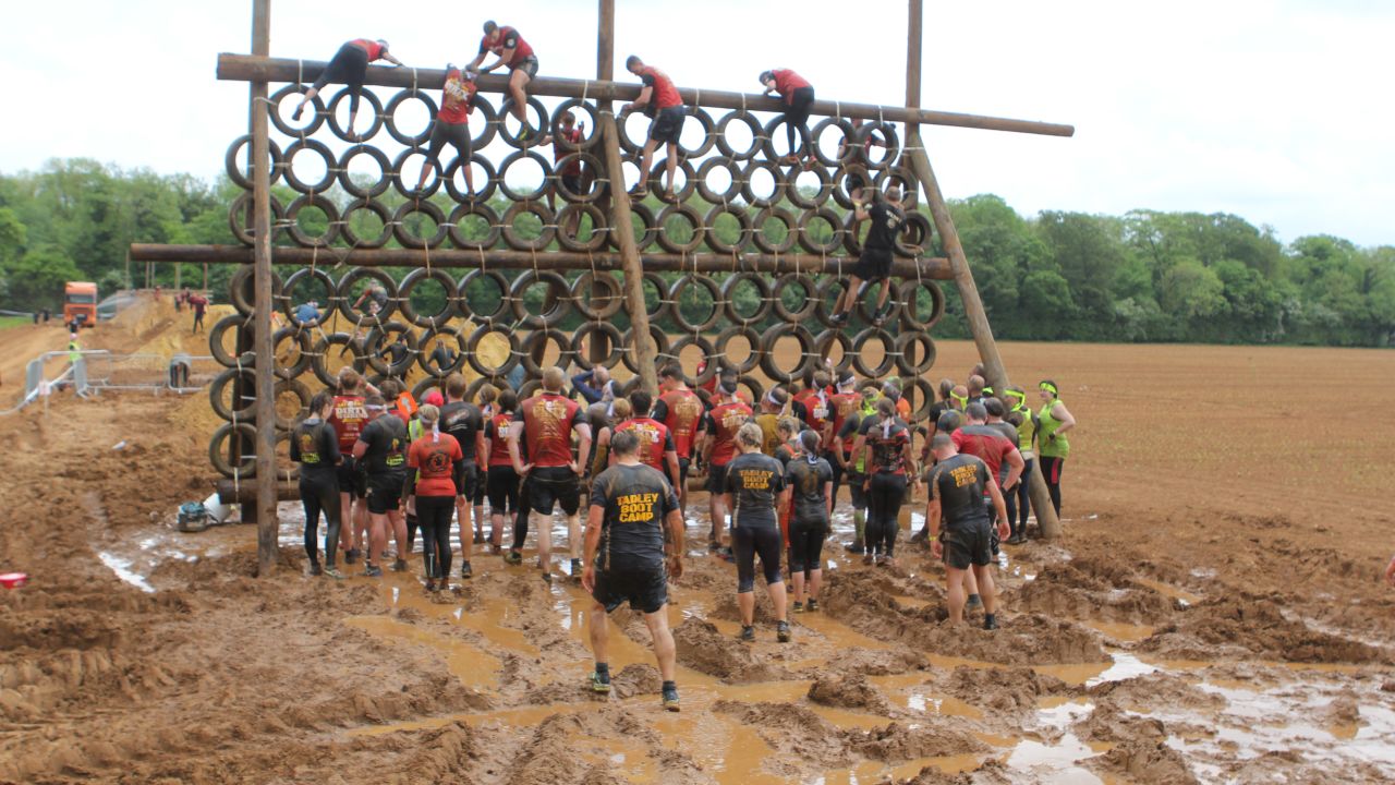 One section required pulling yourself through troughs of muddy water and then over a wall of tires. 