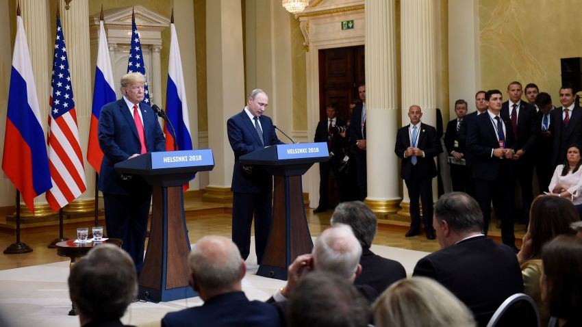 U.S. President Donald Trump listens as Russian President Vladimir Putin speaks during a join press conference at the Presidential Palace in Helsinki, Finland, Monday, July 16, 2018. (Antti Aimo-Koivisto/Lehtikuva via AP)
