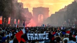 TOPSHOT - People celebrate France's victory in the Russia 2018 World Cup final football match between France and Croatia, on the Champs-Elysees avenue in Paris on July 15, 2018. (Photo by Eric FEFERBERG / AFP)        (Photo credit should read ERIC FEFERBERG/AFP/Getty Images)