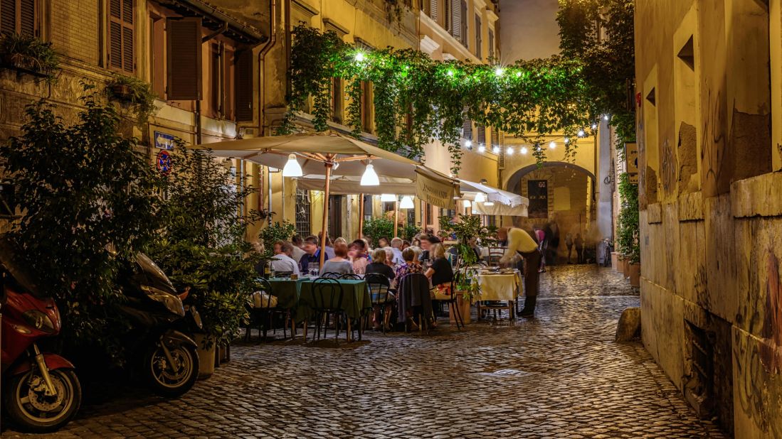<strong>November in Rome, Italy:</strong> People gather at a restaurant in Trastevere for another great Italian meal. This bohemian neighborhood, known for its cobblestone streets and nightlife, is southeast of Vatican City along the banks of the Tiber River.