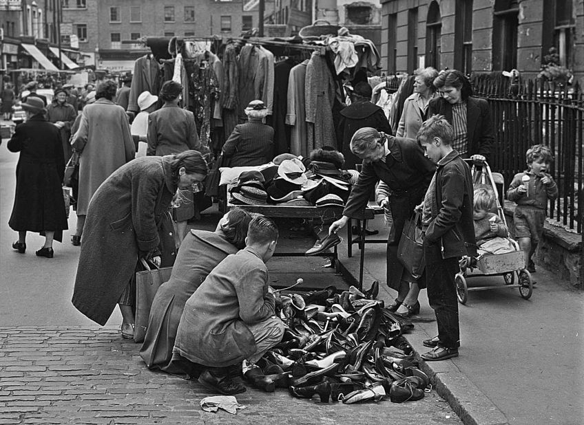 A family hunts for shoes at an East End market in the 1940s. 