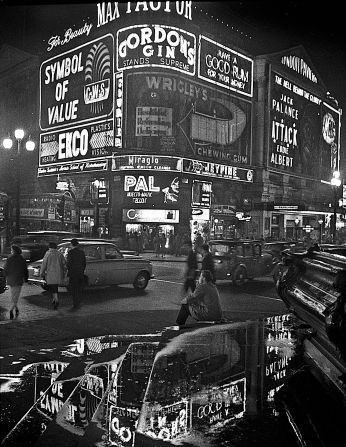 Piccadilly Circus, alight with neon. 