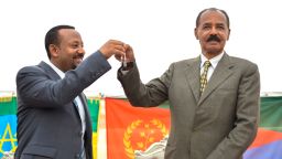 Ethiopian Prime Minister Abiy Ahmed (L) and President Isaias Afeworki of Eritrea (R) celebrate the reopening of the Embassy of Eritrea in Ethiopia as relations between both countries thaw. 
