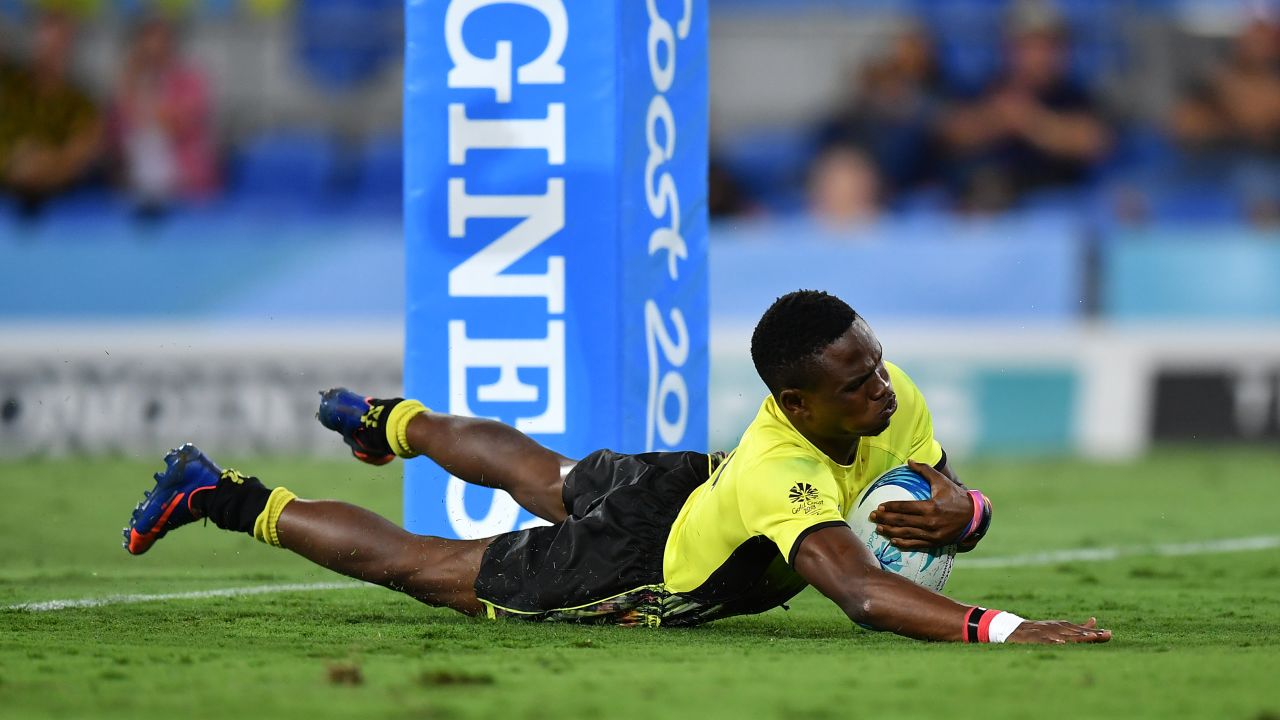 Adrian Kasito crosses the line during Uganda's 33-10 win over Sri Lanka at the Commonwealth Games.