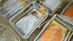 UNDISCLOSED, GERMANY - AUGUST 12:  A 4-day-old newborn baby, who has been placed among empty baby beds by the photographer, lies in a baby bed in the maternity ward of a hospital (a spokesperson for the hospital asked that the hospital not be named) on August 12, 2011 in a city in the east German state of Brandenburg, Germany. According to data released by Eurostat last week Germany, with 8.3 births per 1,000 people, has the lowest birth rate in all of Europe. Eastern Germany, which not only suffers from a low birth rate, also has a declining population due to young people moving away because of high unemployment in the region. Europe as a whole suffers from a low birth rate and a growing elderly population.  (Photo by Sean Gallup/Getty Images)