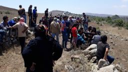 Syrians approach occupied Golan Heights on July 17.