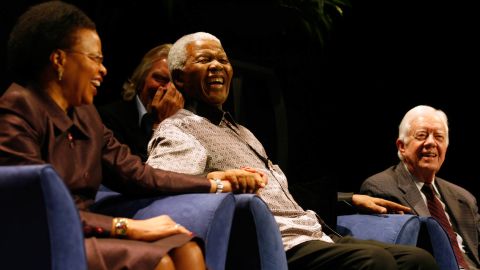 Graça Machel, Richard Branson (background), Nelson Mandela and Jimmy Carter at the public launch of The Elders in Johannesburg on July 18, 2007.