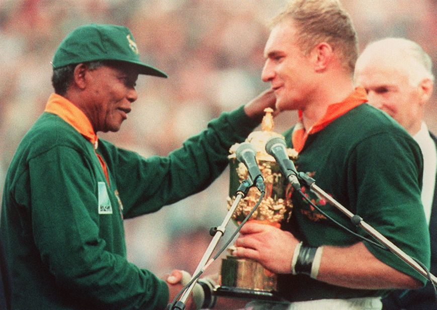 It's one of rugby's most iconic images -- South African President Nelson Mandela presenting the World Cup to Springbok captain Francois Pienaar in 1995. The victory helped unite the nation shortly after the end of apartheid. 