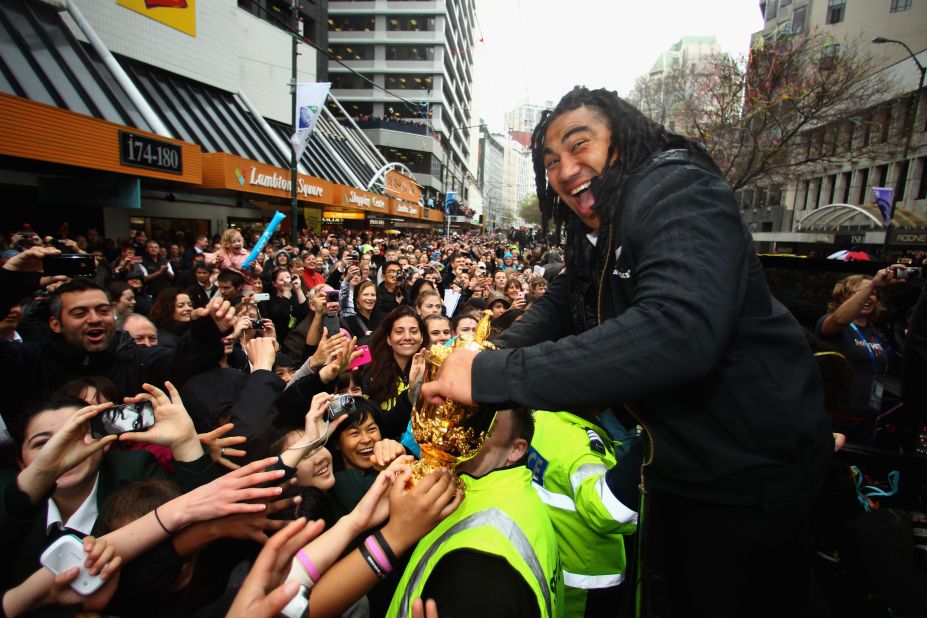 The All Blacks ended a 24-year drought when they lifted the Web Ellis trophy on home soil in 2011. Here, Ma'a Nonu greets raucous crowds during the victory parade in Wellington. 