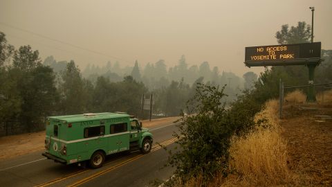A fire transport drives along Highway 140, one of the entrances to Yosemite National Park. 