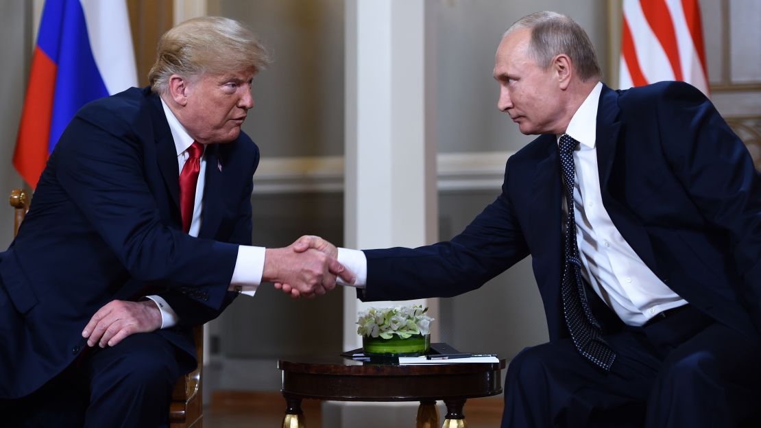 Russian President Vladimir Putin and US President Donald Trump shake hands before a meeting in Helsinki, on July 16.