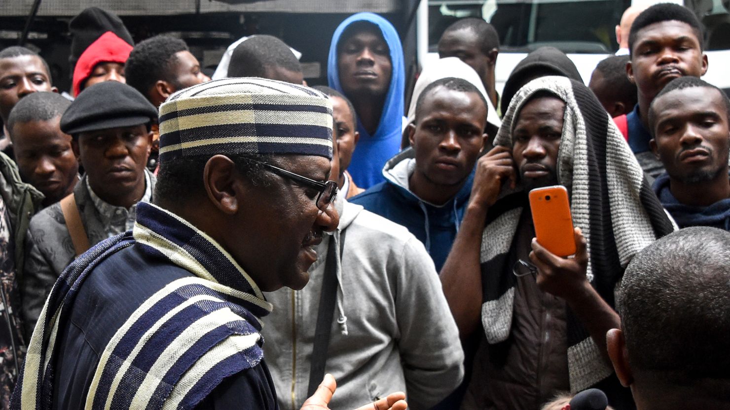 Ambassador of Nigeria to Russia Steve Davies Ugbah (L) speaks with Nigerians in front of Nigerian embassy in Moscow on July 13, 2918. Photo: VASILY MAXIMOV/AFP/Getty Images