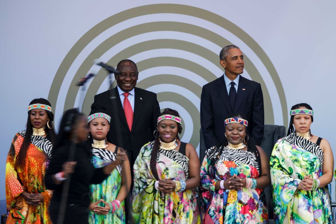 Former US President Barack Obama, right, with South African President Cyril Ramaphosa standing behind the Soweto Gospel Choir. 