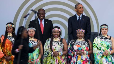 Former US President Barack Obama, right, with South African President Cyril Ramaphosa standing behind the Soweto Gospel Choir. 