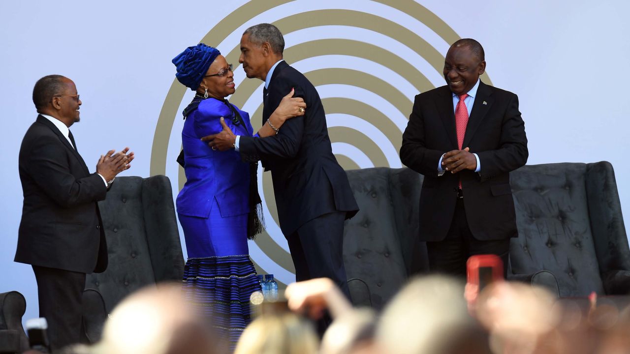 Nelaon Mandela's widow, Graça Machel, center left, greeting Barack Obama on Tuesday. 