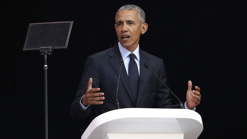 Former U.S. President Barack Obama, left, delivers his speech at the 16th Annual Nelson Mandela Lecture at the Wanderers Stadium in Johannesburg, South Africa, Tuesday, July 17, 2018. In his highest-profile speech since leaving office, Obama urged people around the world to respect human rights and other values under threat in an address marking the 100th anniversary of anti-apartheid leader Nelson Mandela's birth. (AP Photo/Themba Hadebe)