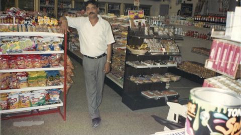 Hasmukh Patel, who was killed in 2004, stands inside his food mart.
