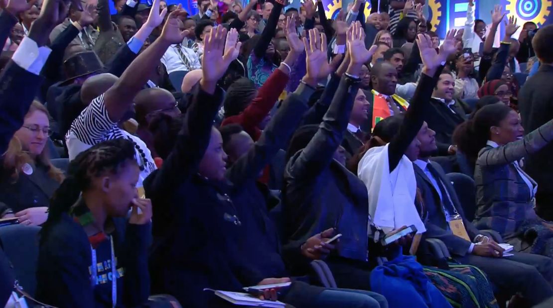 The enthusiastic crowd raises their hands in a bid to ask Obama a question on Wednesday. 