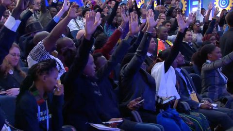 The enthusiastic crowd raises their hands in a bid to ask Obama a question on Wednesday. 