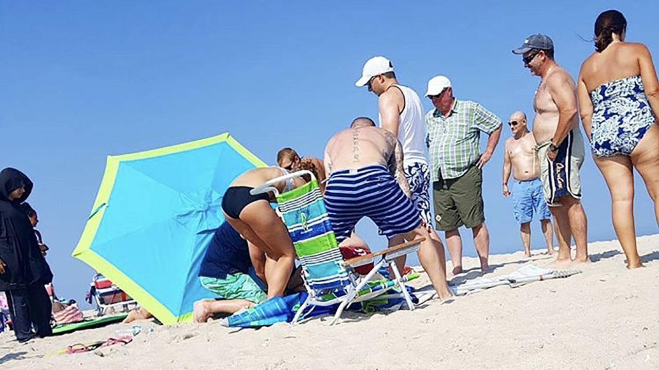 The rod of the umbrella was cut off on the beach so Margaret Reynolds could be taken to the hospital.