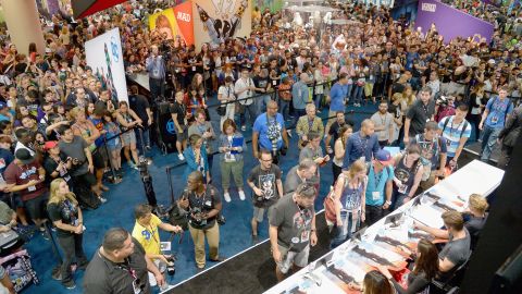 Connie Nielsen, Chris Pine, Gal Gadot and director Patty Jenkins from the 2017 feature film 'Wonder Woman' sign autographs for fans in DC's 2016 San Diego Comic-Con booth.