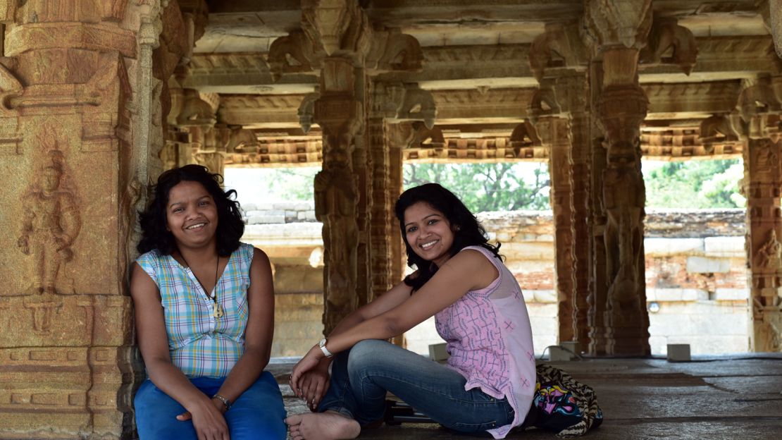 The sisters relax in the ruins of Hampi, a UNESCO-listed heritage site in Karnataka, India. 