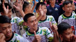CHIANG RAI, THAILAND - JULY 18:  Twelve boys and their coach from the "Wild Boars" soccer team arrive for a press conference for the first time since they were rescued from a cave in northern Thailand last week, on July 18, 2018 in Chiang Rai, Thailand. The 12 boys, aged 11 to 16, and their 25-year-old coach were discharged early from Chiang Rai Prachanukroh hospital after a speedy recovery and thanked those involved in their rescue. (Photo by Linh Pham/Getty Images)