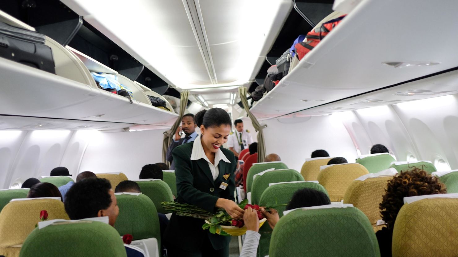 Passengers are welcomed by cabin crew inside an Ethiopian Airlines flight who departed from the Bole International Airport in Addis Ababa, Ethiopia, to Eritrea's capital Asmara on July 18, 2018. (Photo by Maheder Haileselassie Tadese / AFP/Getty Images)