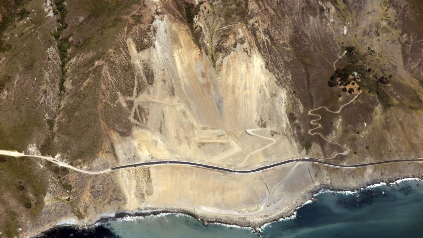 This Tuesday, July 17, 2018 photo provided by the California Department of Transportation (Caltrans) shows the stretch of Highway 1 that has been rebuilt near Big Sur, Calif., on the California coast. The highway was officially opened for traffic Wednesday morning, July 18. The coastal road that links San Francisco and Los Angeles was blocked by a massive landslide in May, 2017 that moved millions of tons of earth, displacing 75 acres (30 hectares) of land. (Caltrans via AP)