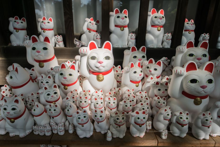 <strong>Decoding the cats: </strong>The maneki-neko goes by many names. The waving cat, the lucky cat, the beckoning cat. It's generally believed the raised right paw is for protection at home.  