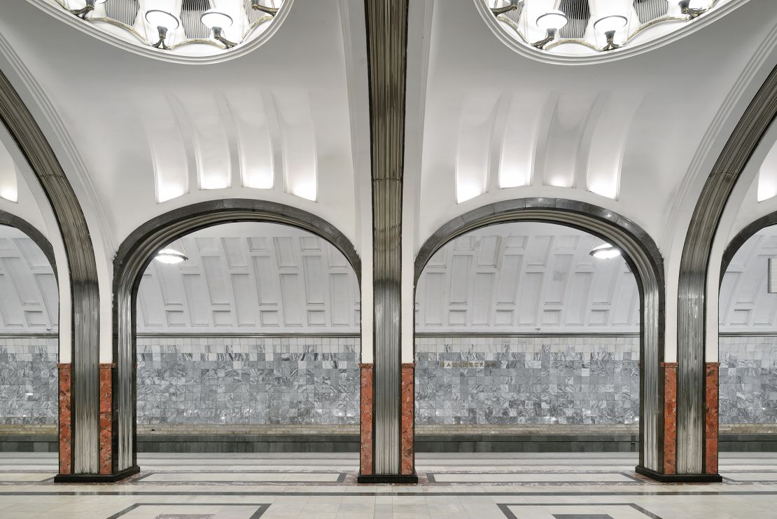 Mayakovskaya station contains brightly-lit concrete domes adorned with murals of Soviet planes streaking across a blue sky. 