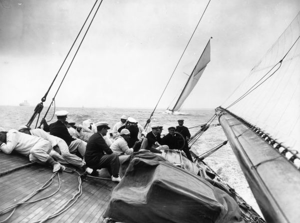 As many as 8,000 competitors take part -- from Olympic and world class yachtsmen to weekend sailors. Pictured here is the crew of the "Shamrock" lying close to the deck to reduce drag as the yacht sails close to the wind.