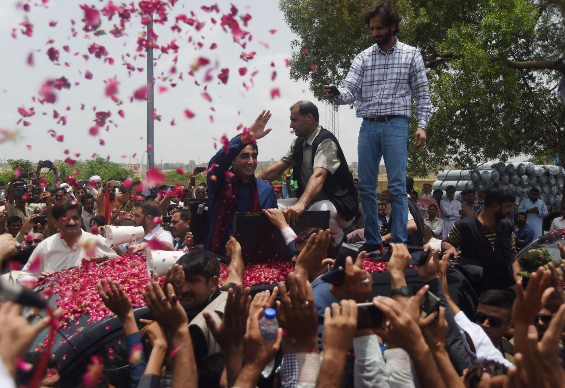 Pakistan Peoples Party (PPP) chairman Bilawal Bhutto Zardari (middle) waves to supporters on the outskirts of Karachi on July 2, 2018.