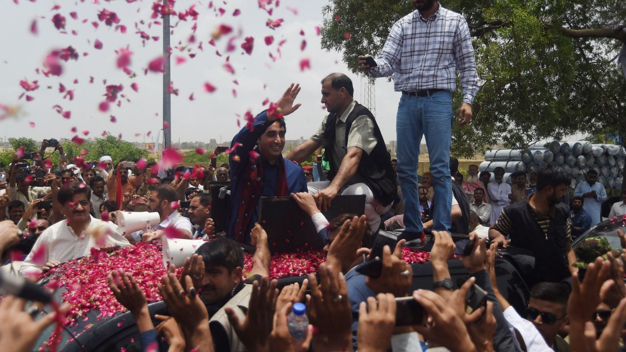 Pakistan Peoples Party (PPP) chairman Bilawal Bhutto Zardari (middle) waves to supporters on the outskirts of Karachi on July 2, 2018.