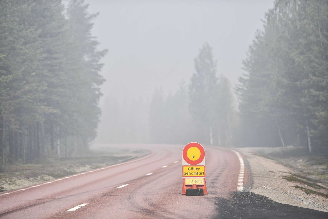 A road is closed to traffic Wednesday near Ljusdal because of forest fires.