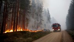 A fire vehicle is seen as fire burns in Karbole, Sweden, on July 15, 2018. - Due to the dry weather, 80 wildfires burned in Sweden. (Photo by Mats ANDERSSON / TT News Agency / AFP) / Sweden OUT        (Photo credit should read MATS ANDERSSON/AFP/Getty Images)
