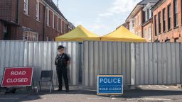 SALISBURY, ENGLAND - JULY 09: Police stand guard on a cordon outside the John Baker House Sanctuary Supported Living in Salisbury on July 9, 2018 in Wiltshire, England. Police have launched a murder enquiry after Dawn Sturgess, 44, died after being exposed to the nerve agent Novichok.  In March, Russian former spy Sergei Skripal and his 33-year-old daughter Yulia were poisoned with the Russian-made Novichok in the town of Salisbury. (Photo by Matt Cardy/Getty Images)