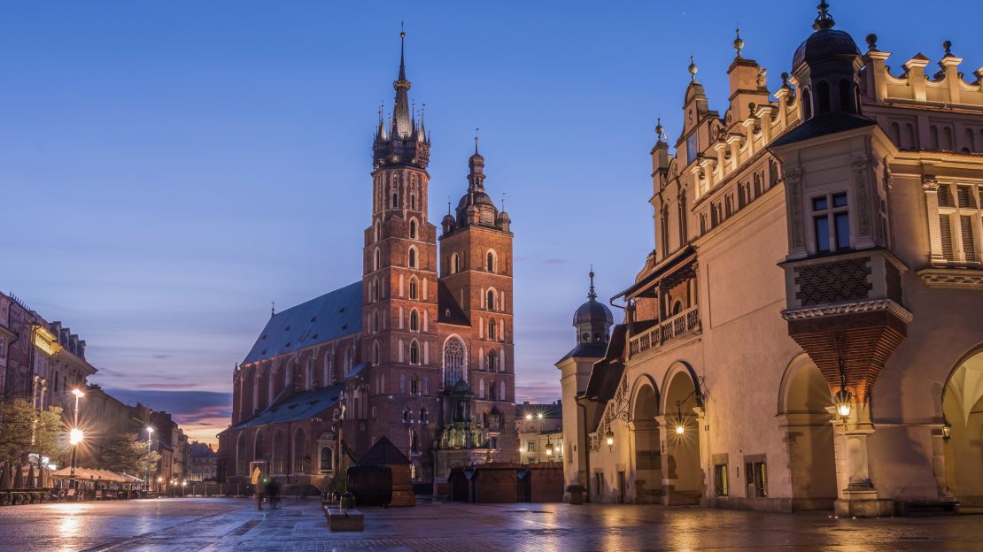 Main Market Square in Krakow looks lovely  illuminated in the night.