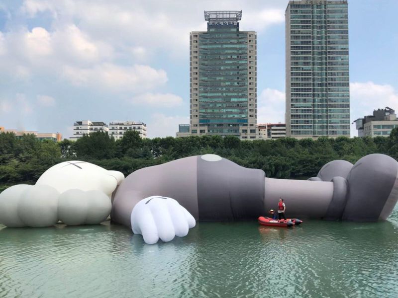 Artist KAWS' giant floating 'Companion' appears on Seoul lake | CNN