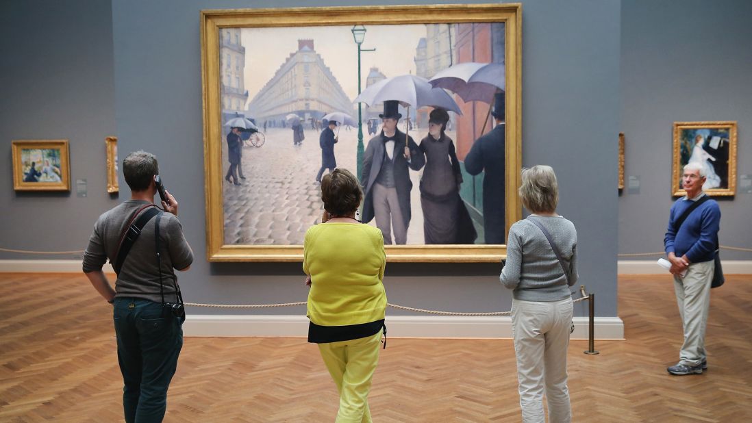 <strong>March in Chicago:</strong> Visitors look over "Paris Street; Rainy Day" by Gustave Caillebotte at the Art Institute of Chicago. Its collection is one of the most admired in the world and a perfect escape if Chicago is still showing its cold side in March.