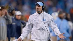 CHARLOTTE, NC - DECEMBER 05:  Head coach Larry Fedora of the North Carolina Tar Heels argues with the officials after his team was called offsides on a onside kick during the final minute of the Atlantic Coast Conference Football Championship against the Clemson Tigers at Bank of America Stadium on December 5, 2015 in Charlotte, North Carolina. Clemson won 45-37.  (Photo by Grant Halverson/Getty Images)