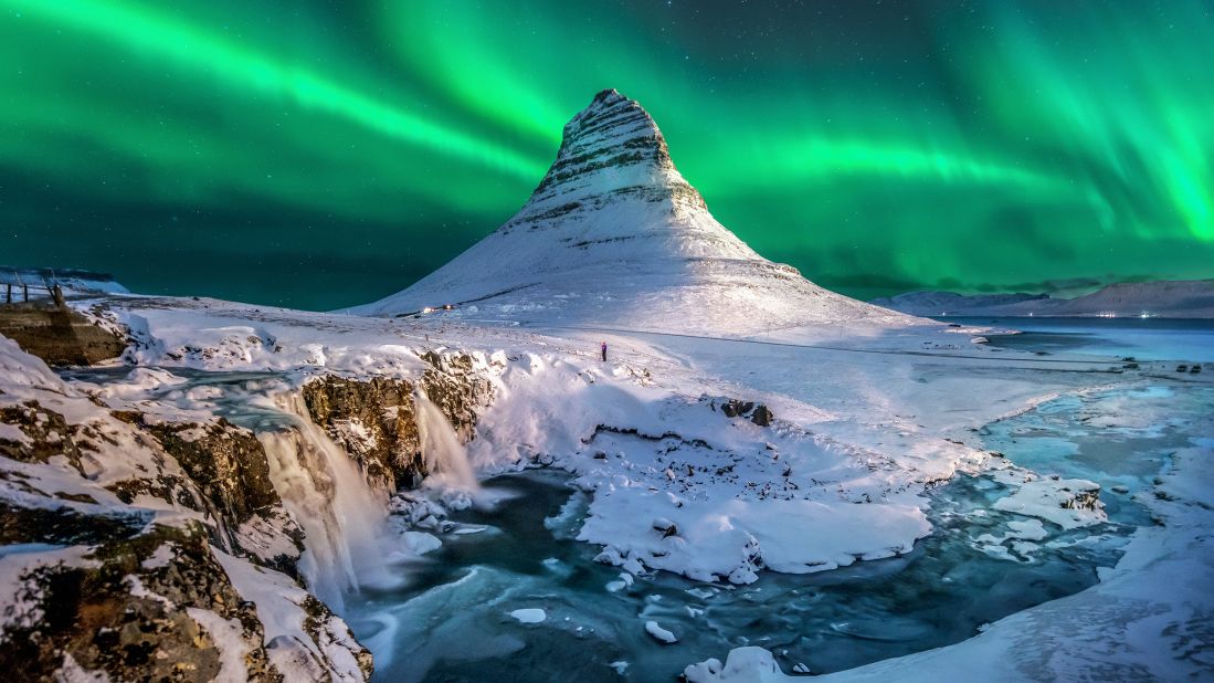 <strong>March in Iceland:</strong> The aurora borealis creates a surreal light show above Mount Kirkjufell on the north coast of Iceland's Snæfellsnes Peninsula.