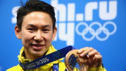SOCHI, RUSSIA - FEBRUARY 15:  Bronze medalist Denis Ten of Kazakhstan celebrates during the medal ceremony for the Men's Figure Skating on day 8 of the Sochi 2014 Winter Olympics at Medals Plaza on February 15, 2014 in Sochi, Russia.  (Photo by Clive Mason/Getty Images)