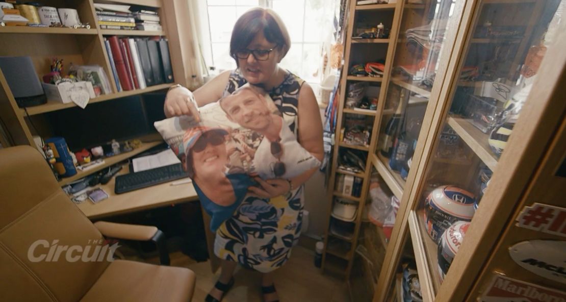 Formula One superfan Sarah Merritt shows her Jenson Button cushion