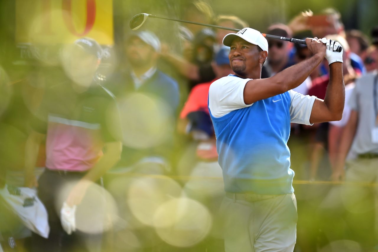 Woods tees off from No. 10 during the first round on Thursday. It was his first time back at the Open since 2015.