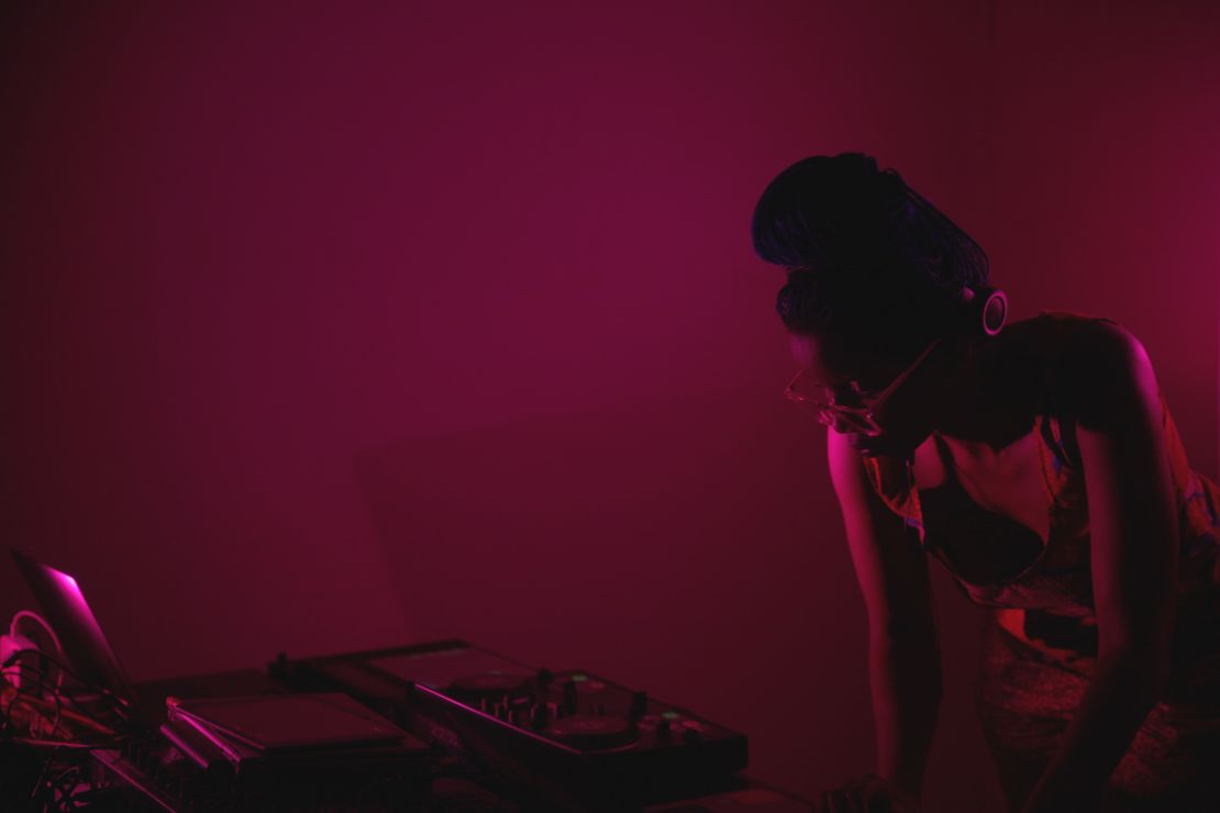 A pink-tinted Kampire DJing at Pussy Party.